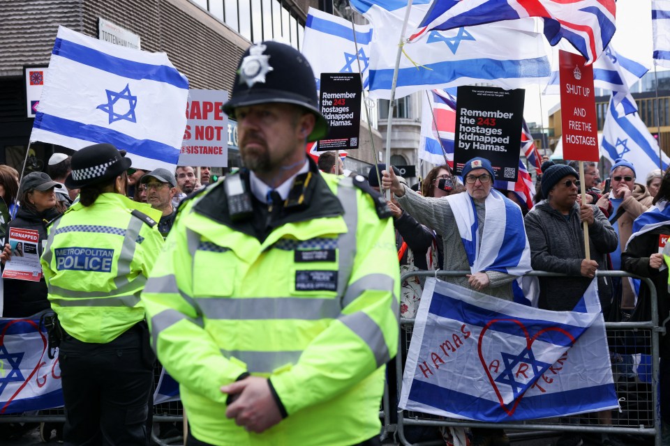 Police stand guard as pro-Israel and pro-Palestine protesters face off in London