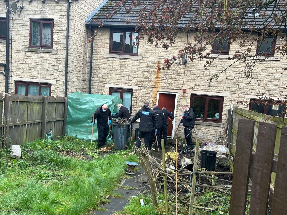 Officers searching a property’s back garden