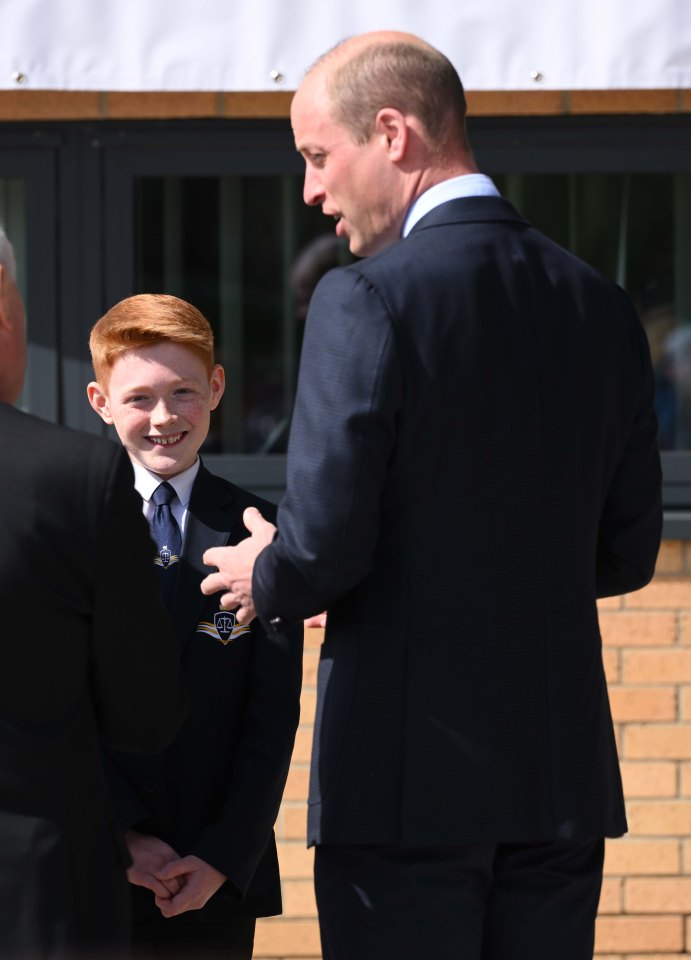 Freddie beamed as he shook hands with the royal