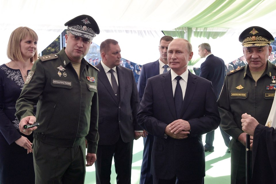 Putin with Ivanov, left, back in 2018