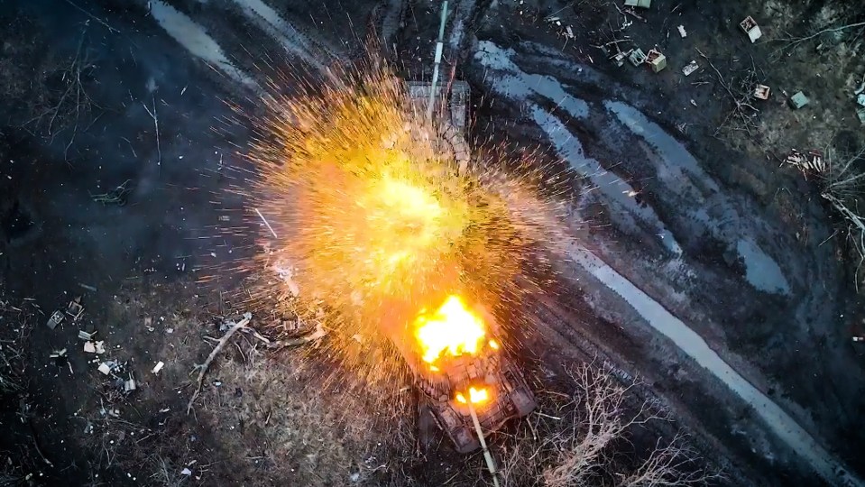 This particular tank explodes into a huge fireball after being hit by a bomb dropped from a drone