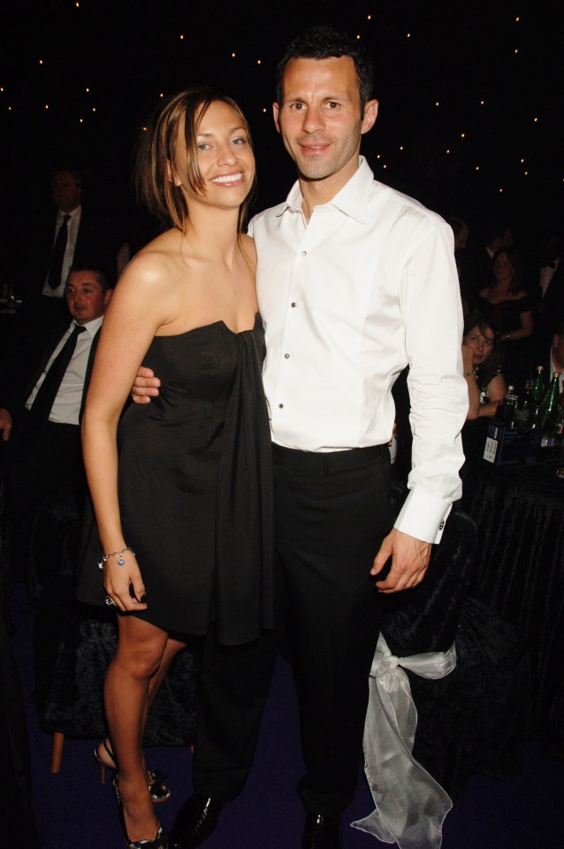 a man in a white shirt stands next to a woman in a black dress