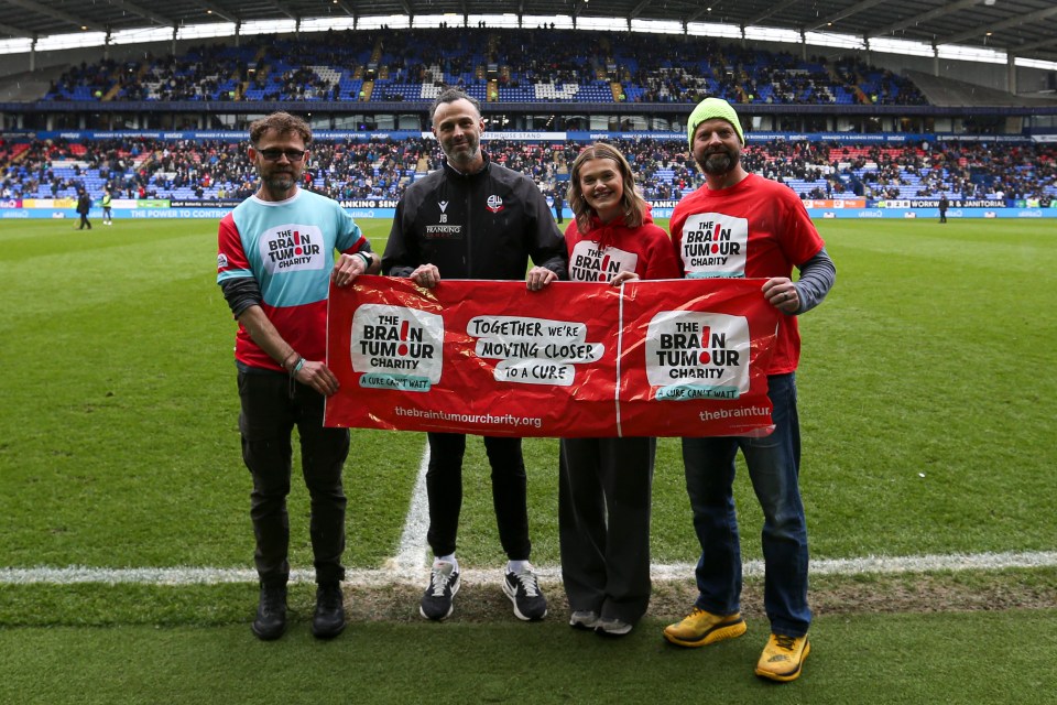 The team at the end of their charity walk to the Tough Sheet Stadium