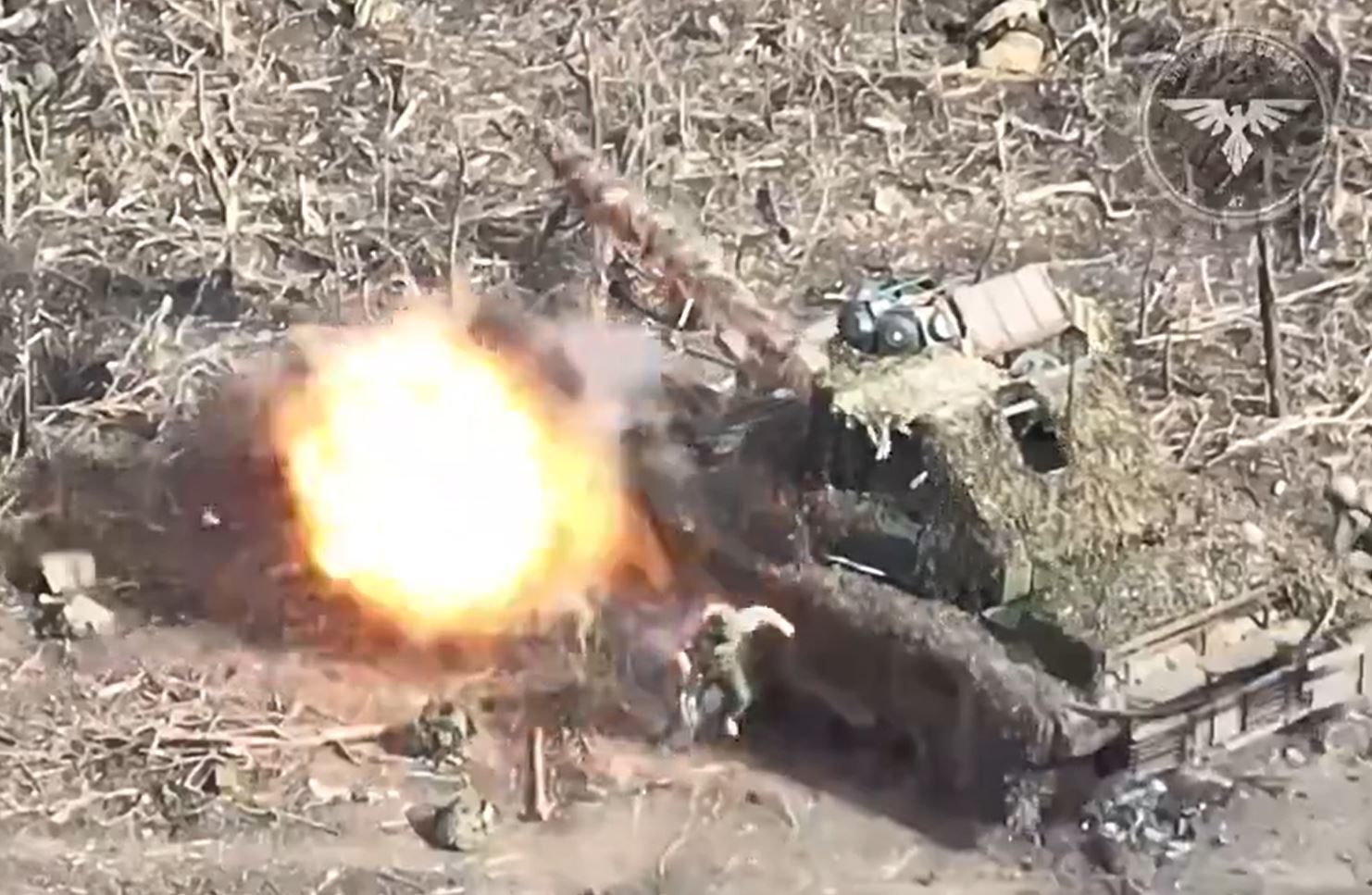 A Russian tank comes under fire from Ukrainian kamikaze drones this morning