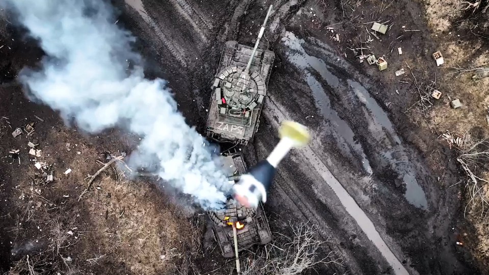 Video also emerged of soldiers of the Armed Forces dropping grenades on Russian tanks