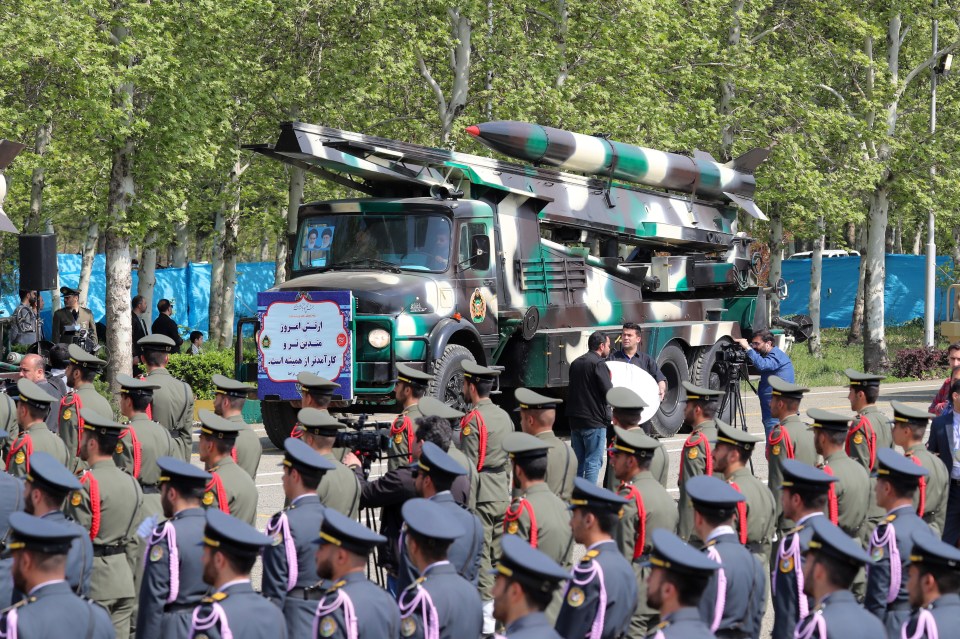 Iranian missiles wheeled through the military parade