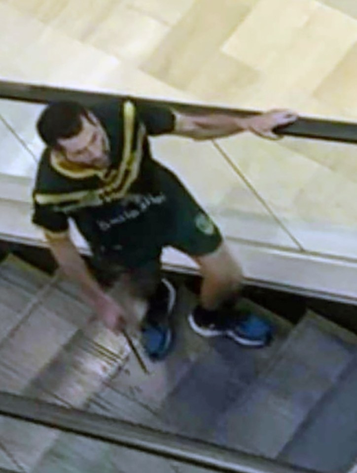 The knifeman ascends an escalator in the shopping centre