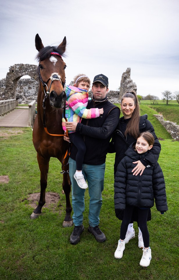 Trainer Christian Williams with his wife Charlotte and daughters Betsey, left and Tilly, with Kitty's Light who will bid to win the Grand National for the Welsh family