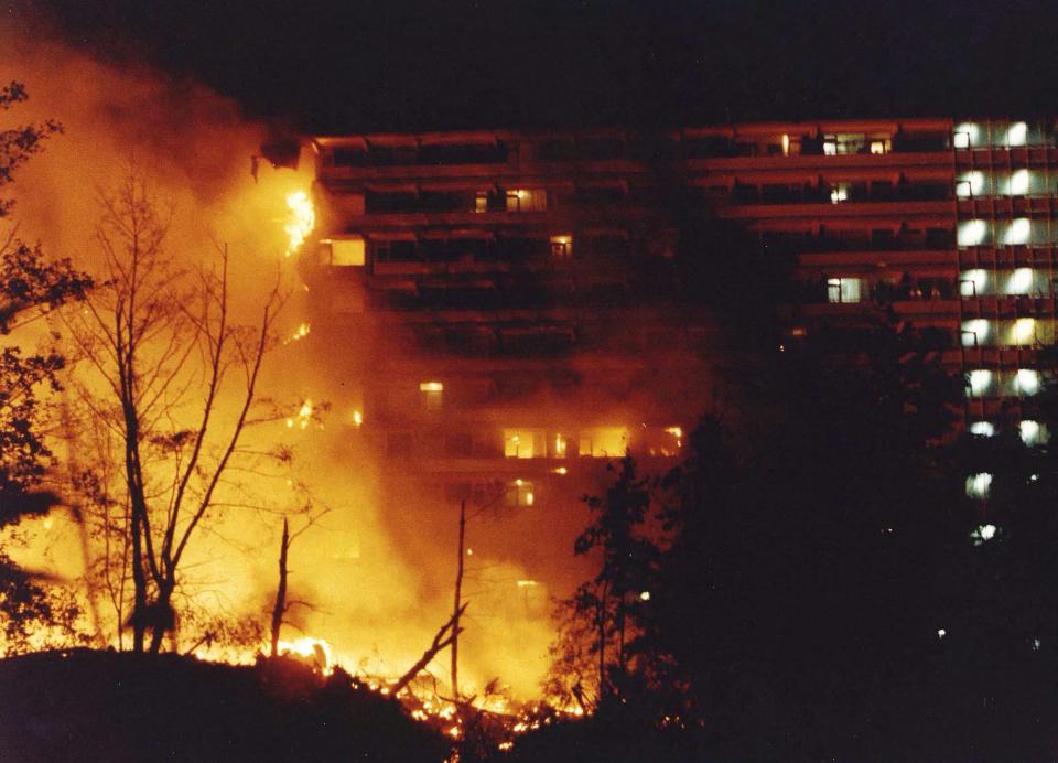 The plane exploded in a fireball and the building collapsed inward, destroying dozens of apartments