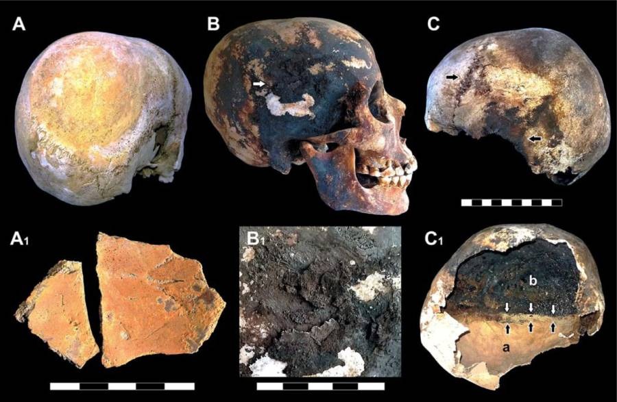 Researchers found black and red mineral residue on the skeletal remains of victims