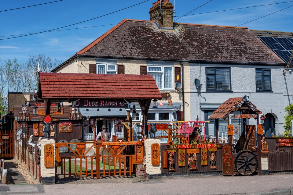 Stephen’s front garden has a graveyard, old wagon wheels, swinging saloon doors and a sign welcoming visitors