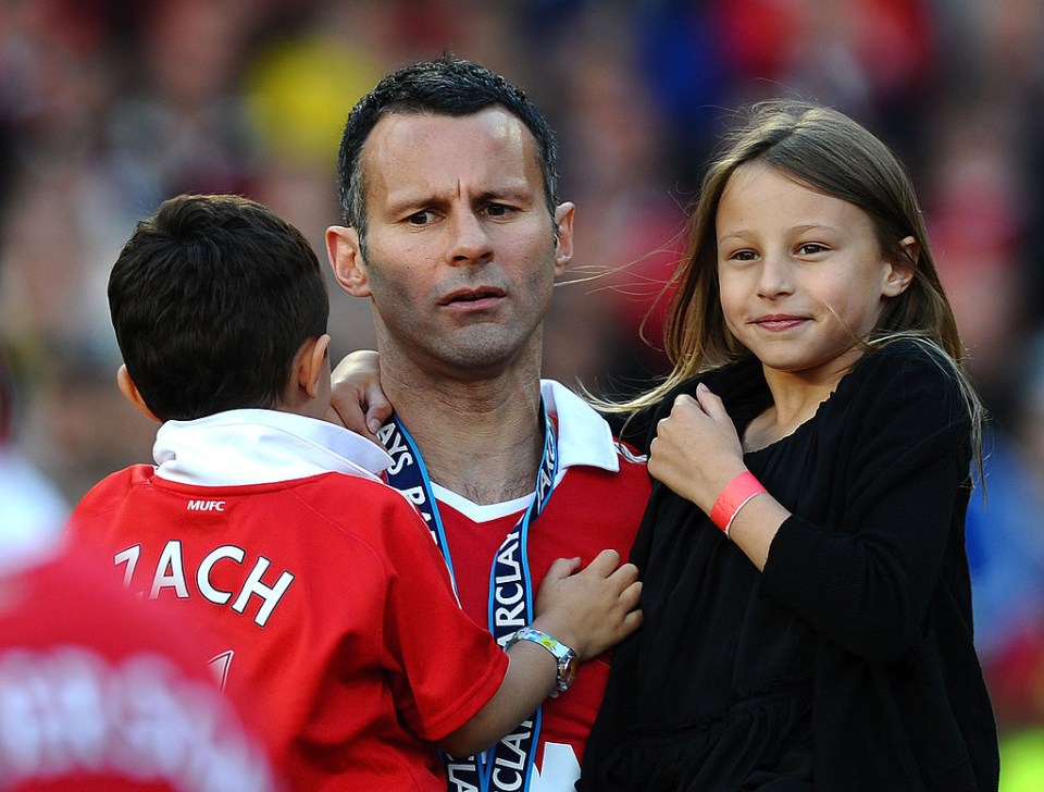 The United ace celebrates with his children, Zach and Libby, after winning the league in 2011