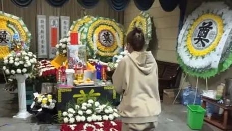 Several wreaths lay at Nana's funeral