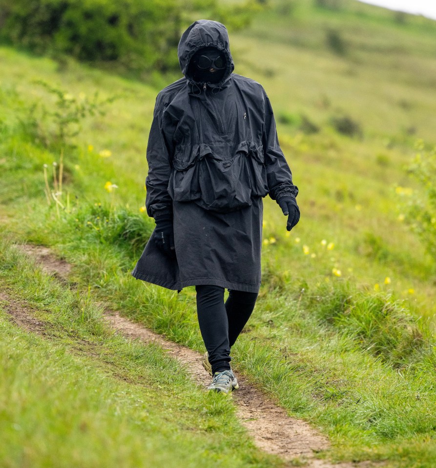 Liam Gallagher goes for a stroll with his hood up and goggles on in the Cotswolds