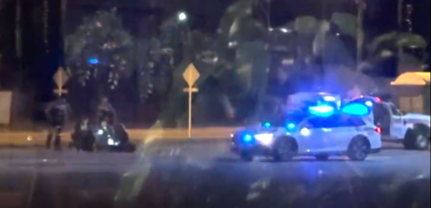 Police rushing to the scene late last night outside a hardware store in a Perth suburb