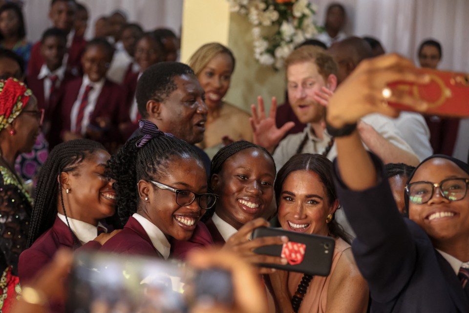 Schoolchildren snapped selfies with Meghan