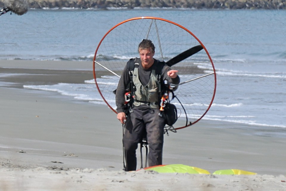 Bear landed carrying camera equipment as he prepares to film for the Netflix reality show