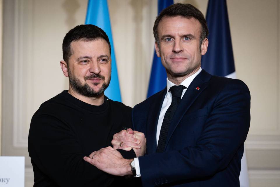 French President Emmanuel Macron, right, said he will help pal Volodymyr Zelensky by sending his troops to fight in Ukraine in a move that has angered the Kremlin