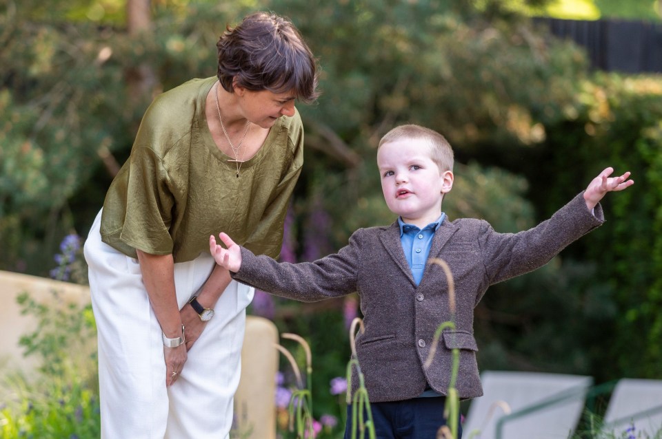 Freddie with designer Miria Harris as the Stroke Association’s garden at the Chelsea Flower Show