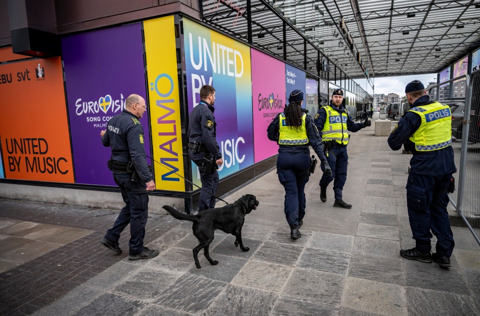 Police with bomb dogs outside Malmo Arena, in Malmo, Sweden, on April 26