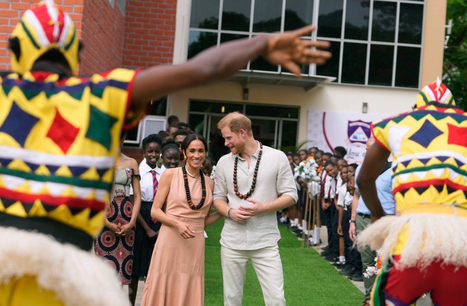 The couple were given strings of wooden beads on arrival