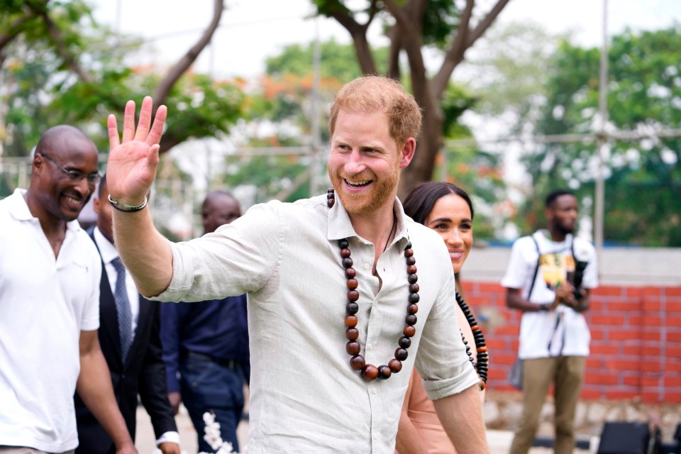 Prince Harry waved to the crowds at the Lights Academy in Abuja on Friday