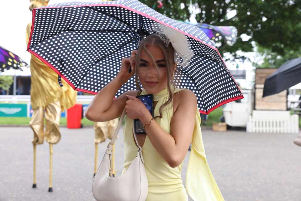 One woman tried to avoid the rain ruining her lemon yellow outfit