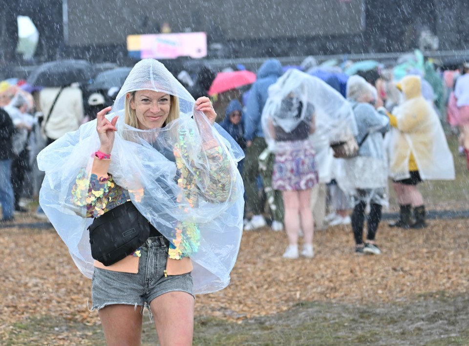 A festival reveller in plastic mac in Luton