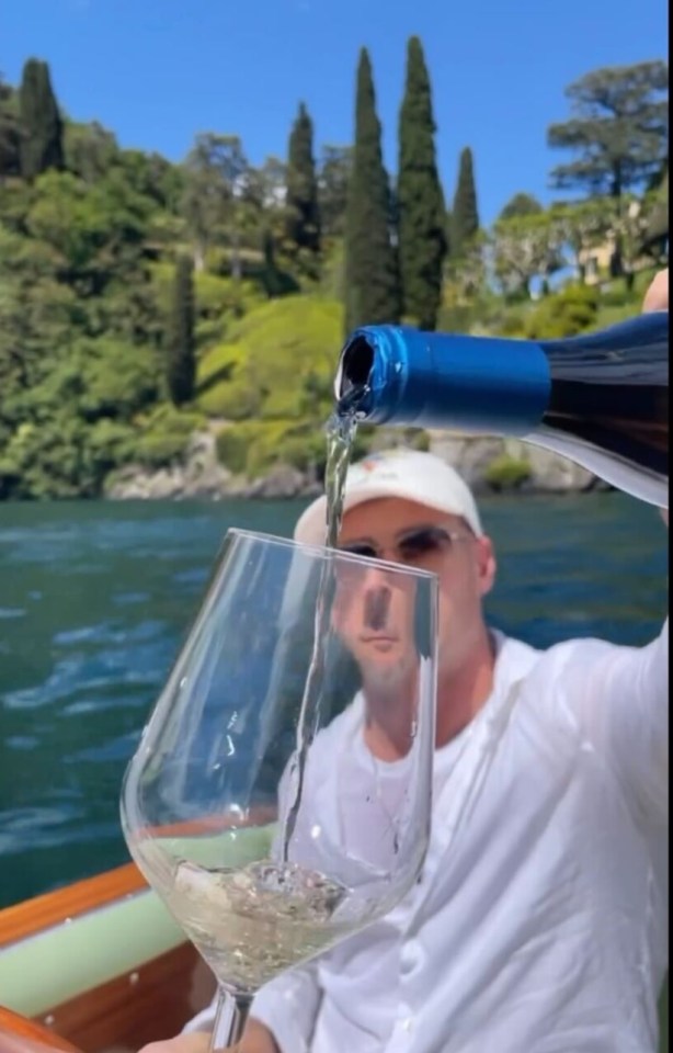 The couple were poured wine as they enjoyed a romantic boat ride