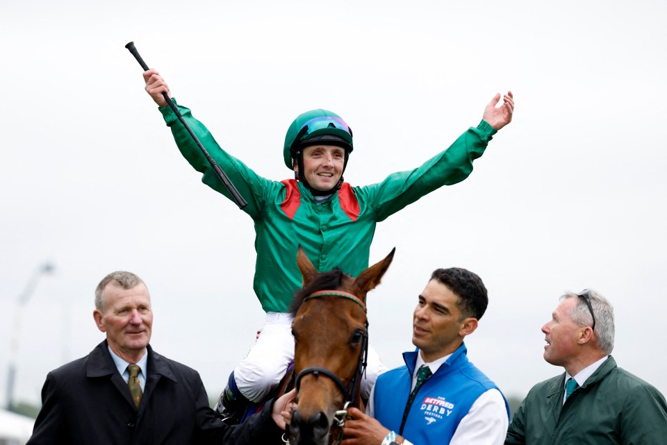 Jockey Chris Hayes celebrates winning the Oaks on Ezeliya