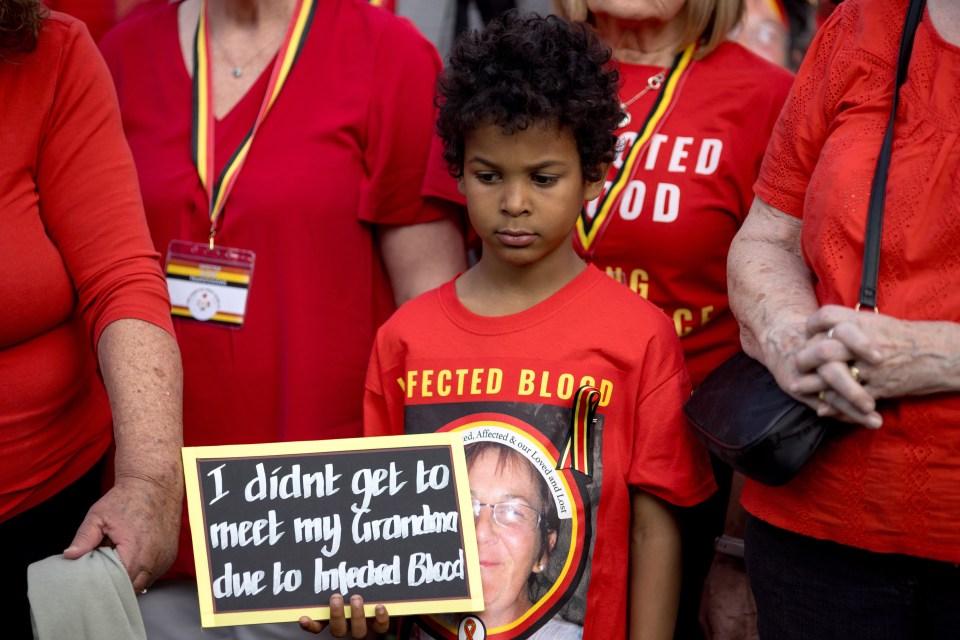 A young boy holding a heartbreaking sign about his grandmother