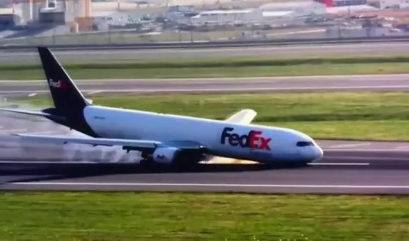 A Boeing FedEx plane sent sparks flying as it nosedived on the runway