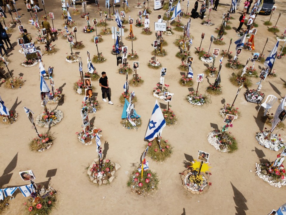 Family members visit the memorial site for victims killed during the music festival