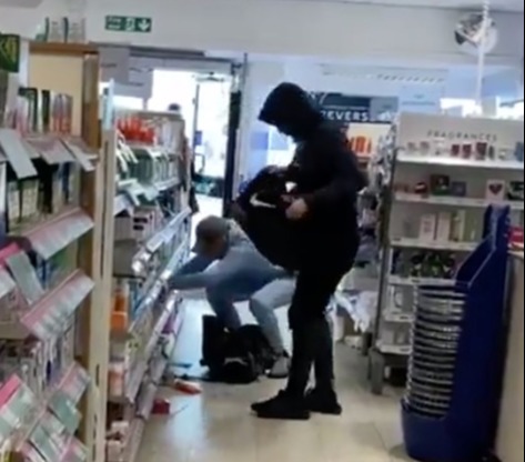 Shoplifting is getting out of control – pictured two thieves loading bags with goods taken from the shelves of a Boots in London