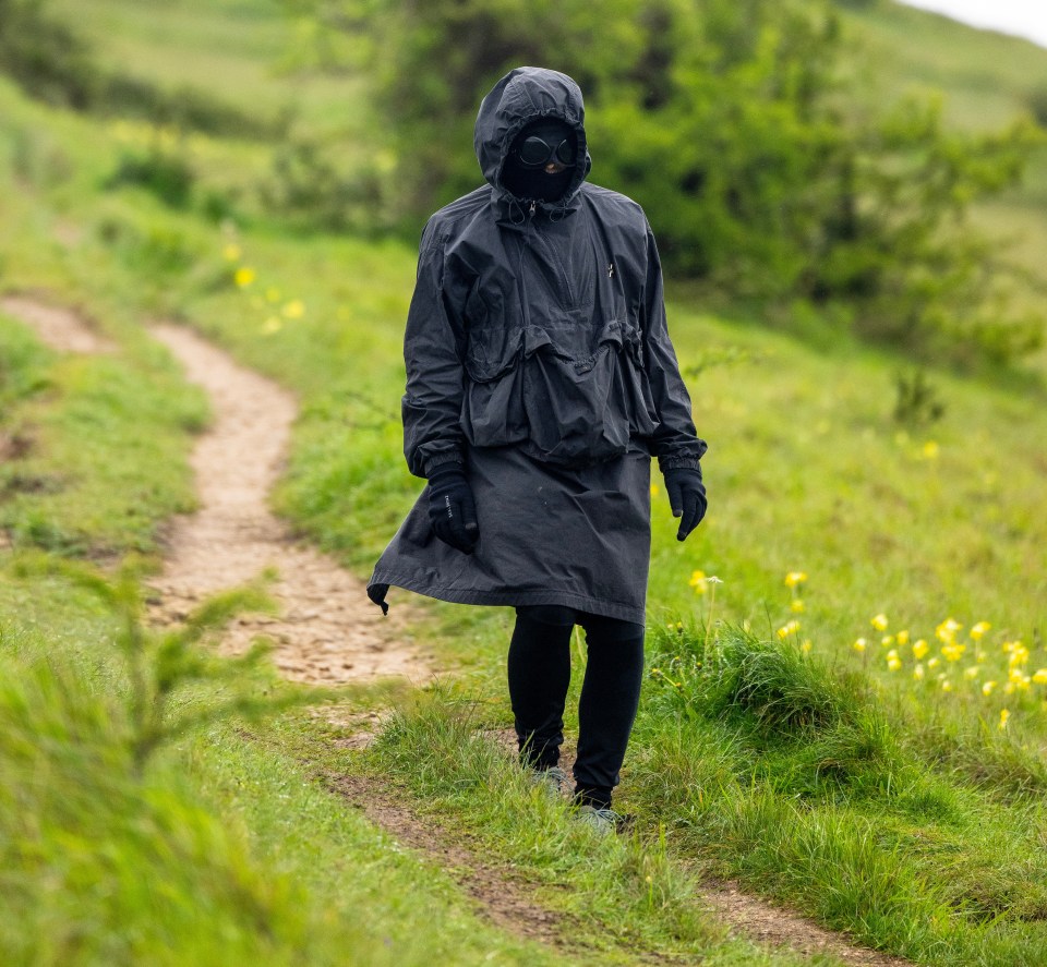 Our exclusive pictures show Liam out for a stroll wearing a black anorak with the hood up and goggles attached