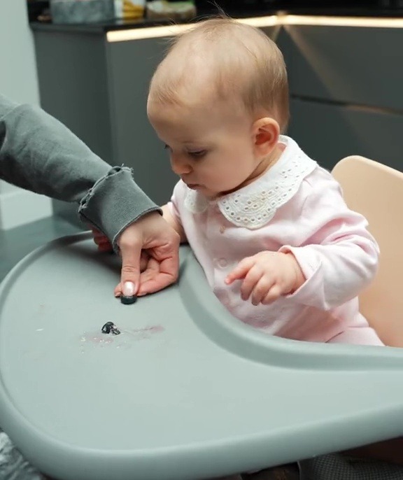 When it comes to blueberries, Ferne squishes them on the highchair tray to make them as safe as possible for her bby