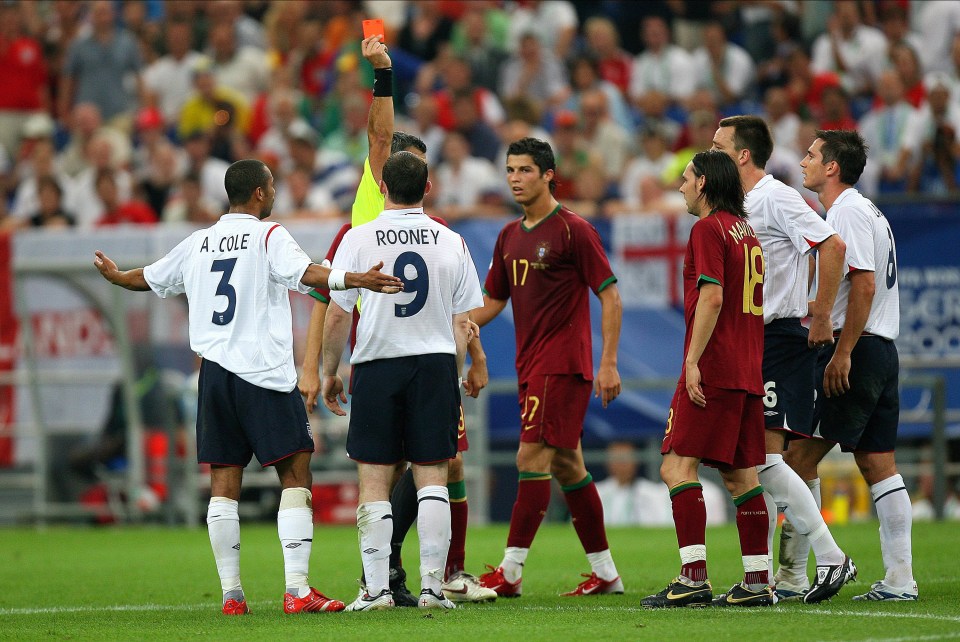 GELSENKIRCHEN, GERMANY - July 1: Wayne Rooney of England is shown Red card and sent off by Referee Horacio Elizondo as Cristiano Ronaldo looks on during the FIFA World Cup Finals 2006 Quarter Final match between England and Portugal at Arena Aufschalke on July 1, 2006 in Gelsenkirchen, Germany. (Photo by Richard Sellers/Sportsphoto/Allstar via Getty Images)