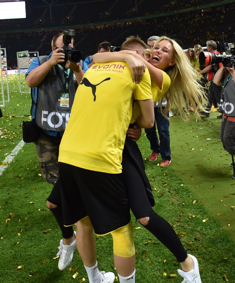 Reus is cheered on by his doting wife Scarlett Gartmann