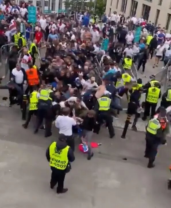 Scores of ticketless fans ‘punched’ their way through security barriers and guards