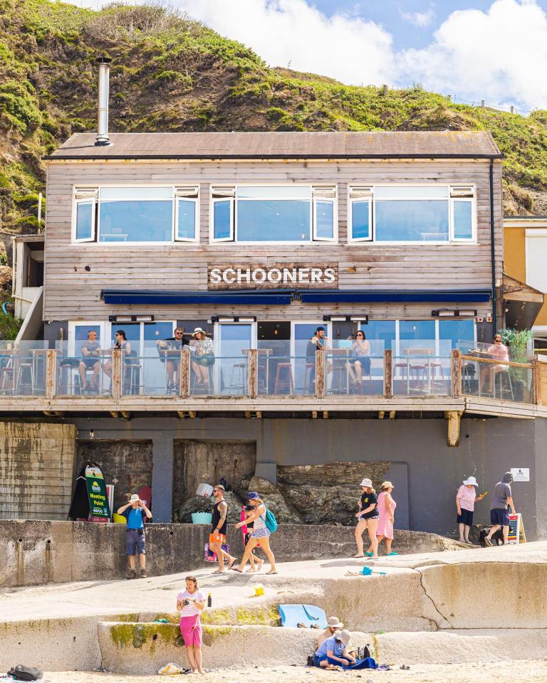 Schooners overlooks the beach from the back of the cove