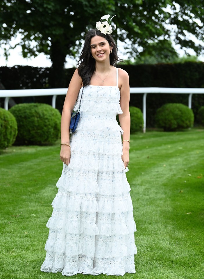 One guest oozed elegance with a tiered, floor-length white dress and matching fascinator