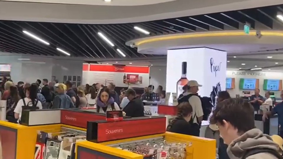 Holidaymakers milling through the airport as they make their way outside