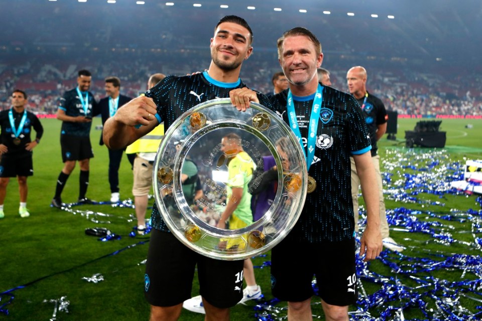 Soccer Aid World XI's Tommy Fury (left) and Robbie Keane with the trophy, following victory in the Soccer Aid for UNICEF 2023 match against England at Old Trafford, Manchester. Picture date: Sunday June 11, 2023. PA Photo. See PA Story SPORT Soccer Aid. Photo credit should read: Will Matthews/PA Wire. RESTRICTIONS: Use subject to restrictions. Editorial use only, no commercial use without prior consent from rights holder.