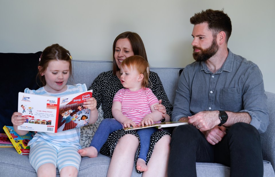 Opal pictured with mum Jo, dad James and sister Nora