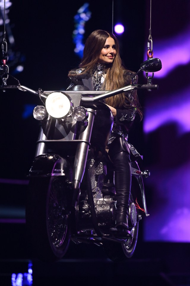 Cheryl and the girls wowed in leather biker gear for one part of the performance