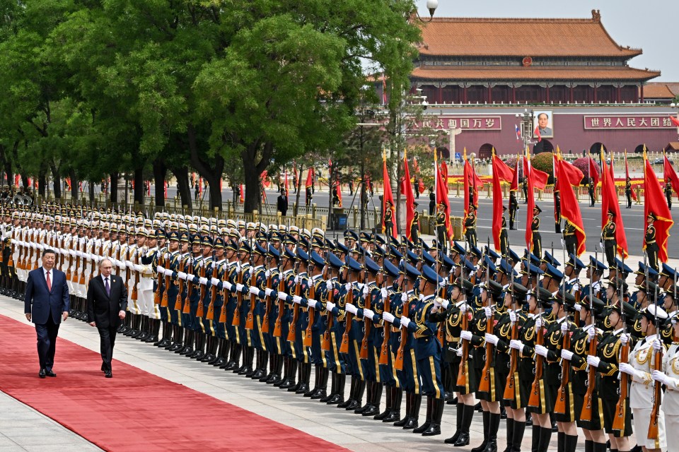 Putin was greeted by Xi with full military honours at the Great Hall of the People