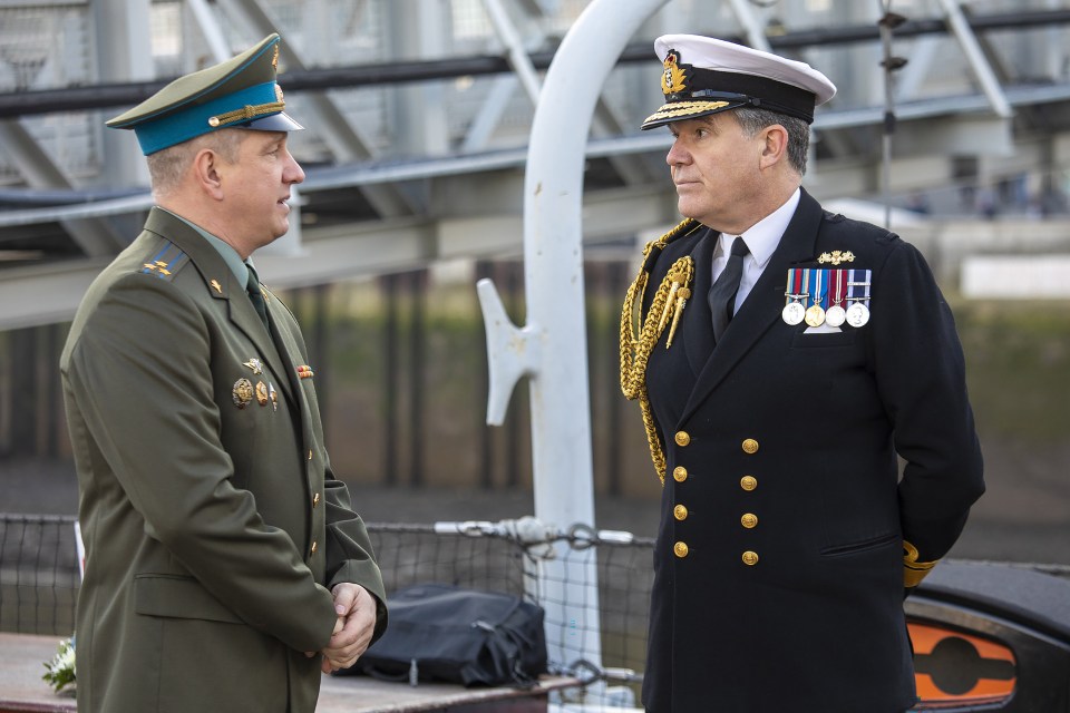 Rear Admiral Iain Lower, right, with Colonel Maxim Elovik ,left, the Russian Defence attache to the UK