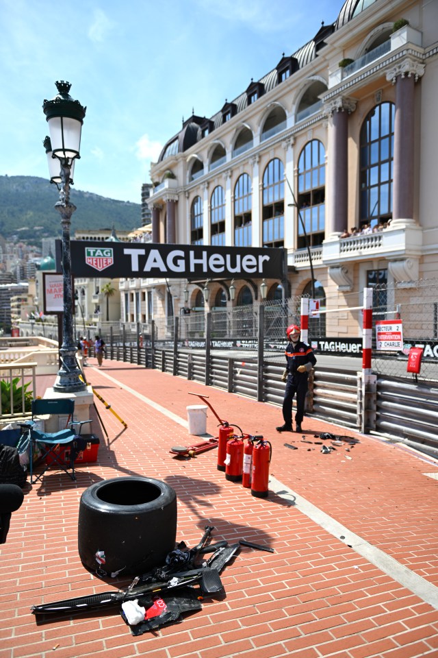 The debris from the crash spilled to the side of the track