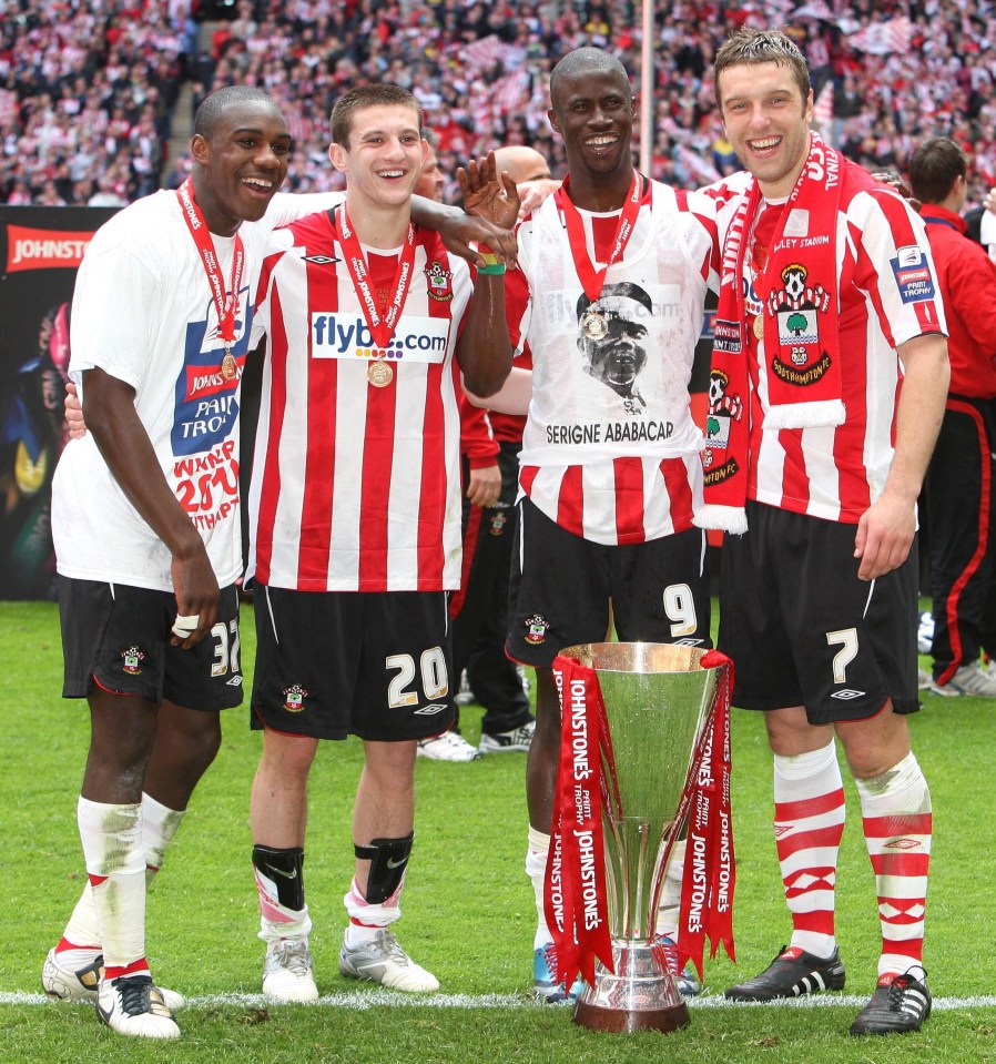 Football - Carlisle United v Southampton Johnstone's Paint Trophy Final - Wembley Stadium - 28/3/10 (L-R) Southampton's four goalscorers Michail Antonio, Adam Lallana, Papa Waigo N'Diaye and Richie Lambert celebrate with the trophy Mandatory Credit: Action Images / Paul Childs Livepic