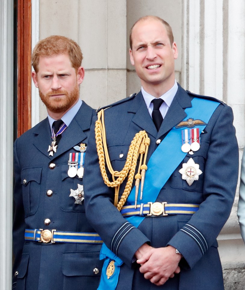 two men in military uniforms are standing next to each other